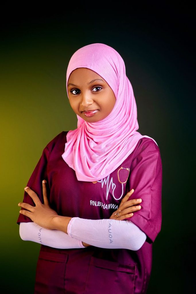 pexels photo 34833862 Portrait of a young nurse wearing a pink hijab with crossed arms, symbolizing confidence and professionalism.